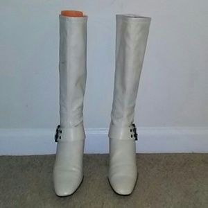 Ivory boots with brown heels and silver accents